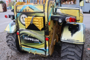 Cat 906 Radlader als Baumaschine im Comic-Stil